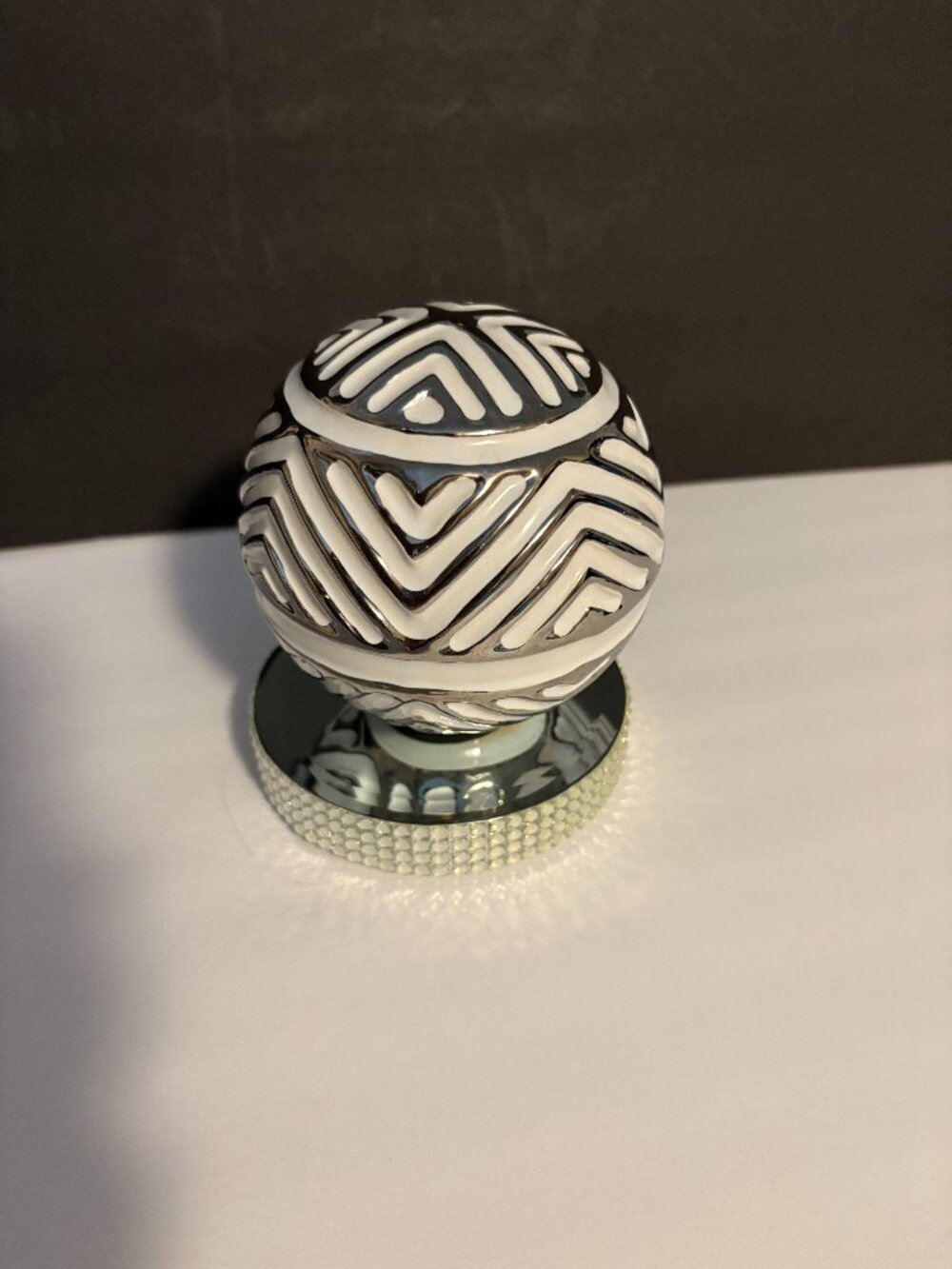 Sand Sphere Ceramic on Mirror Stand